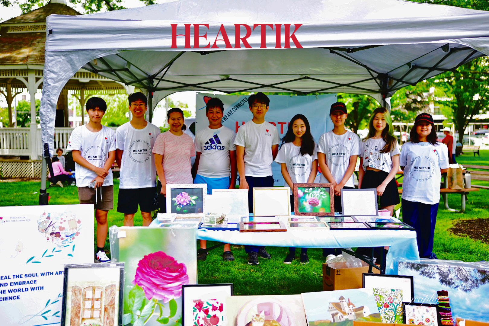 Heartik volunteers with children at a community event